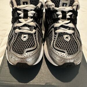 Kids silver and black New Balance 1906 sneakers